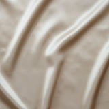 Sidenörngott beige färg, inzoomad bild på siden tyg